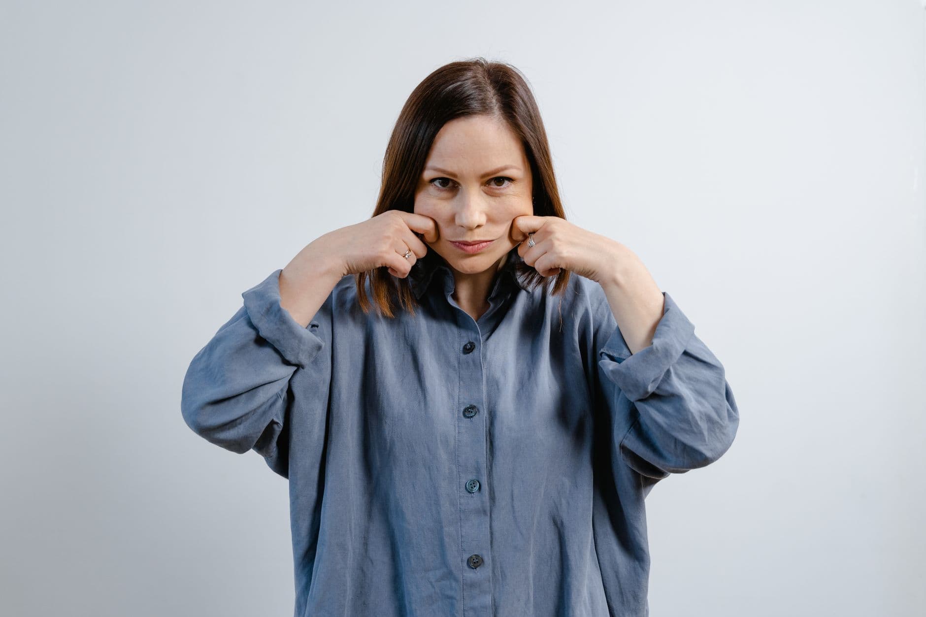 A woman considering facial fat grafting to restore volume