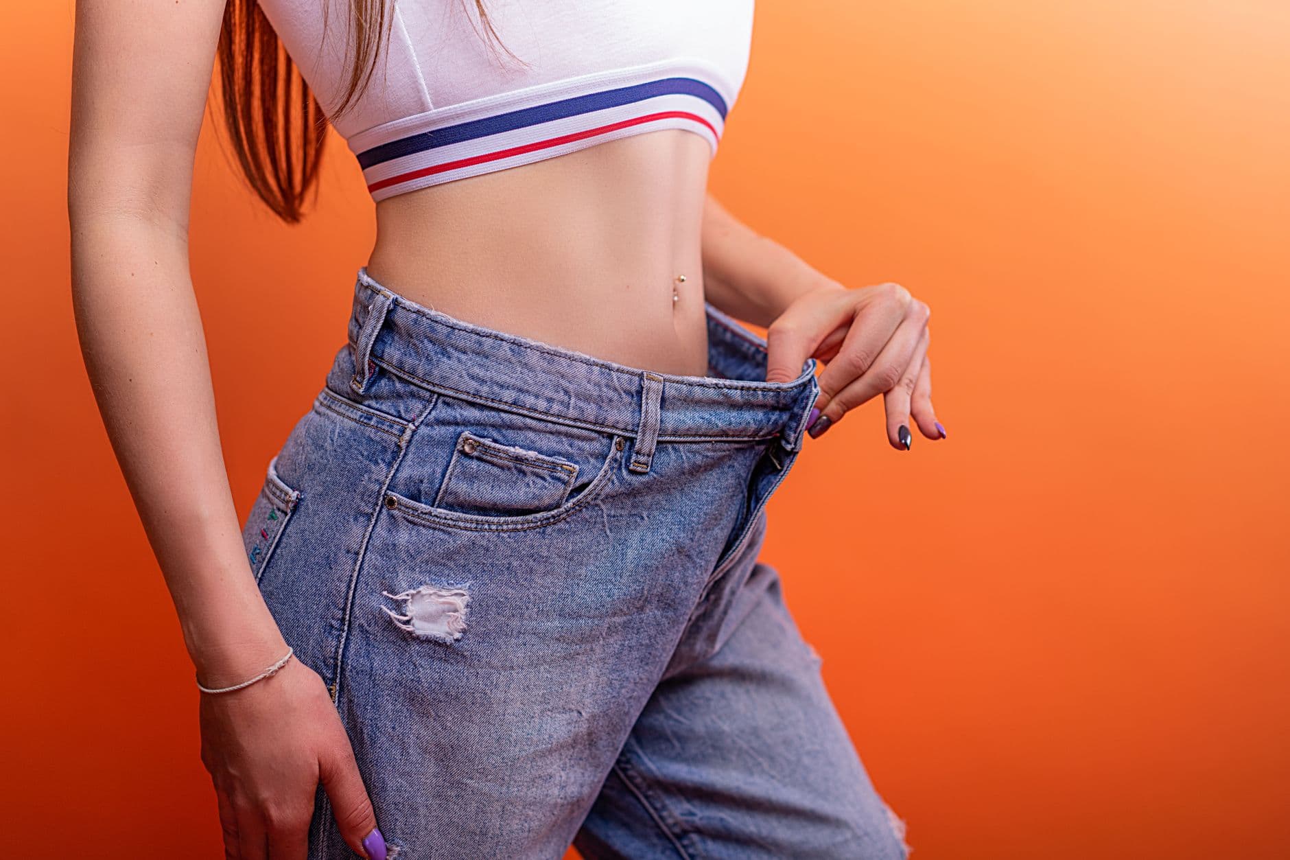 A patient's contoured midsection reflecting her liposuction goals